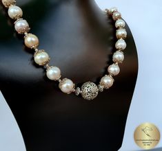 "◎ Statement necklace made from natural freshwater pearls in 4 colors ( white, silver, peach and pink ). Adorned with decorative floral ball element and filigree pearl caps. Everything is handmade from solid sterling 925 silver. ★ ◎ Length: 48 cm ( 18.9\" ) Diameter of the silver ball elements: 1.8 ( 0.70\" ) ◎ Enter the shop, for more of our jewelry, and matching earrings ;) ◎ - - - - - - - - - - - - - - - - - - - - - - - - - - - - - - - - - - - - - - - - - - - - - - - - - - Jewelry will be pac Traditional Single Strand Pearl Necklace For Wedding, Pearl Bridal Necklace With Single Strand Of Round Beads, Single Strand Pearl Bridal Necklace With Round Beads, Handmade Elegant Pearl Necklace With Round Beads, Bridal Necklace With Pearl Pendant And Round Beads, Handmade Formal Bridal Necklace With Round Beads, Handmade Bridal Necklace With Round Beads For Formal Occasions, Handmade Bridal Necklace With Round Beads For Anniversary, Formal Handmade Bridal Necklace With Round Beads