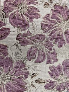 purple and white floral fabric with large flowers on the side, as well as an intricate design