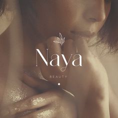 a woman with her hands on her chest and the words naya above her face