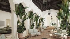 the lobby is decorated with palm trees and star shaped chairs for guests to sit in