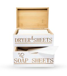 two boxes with soap sheets in them sitting next to each other