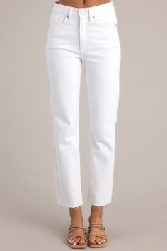 Close up view of these jeans that feature a high-rise waist, a scissor cut-off hem, functional pockets, belt loops, and a zipper button closure. Classic White Cropped Leg Jeans, Classic White Cropped Jeans, Trendy White High-rise Flare Jeans, Classic White Wide Leg Jeans, Classic White Jeans For Work, White High Rise Flare Jeans With Frayed Hem, White High-rise Flare Jeans With Frayed Hem, Classic White Straight Fit Jeans, Trendy High Rise White Jeans