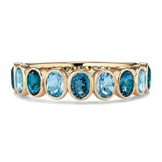 Two shades of natural blue topaz alternate along this stunning bezel-set ring. Crafted in warm 14-karat yellow gold  it features delicate milgrain detail around each hand-selected gemstone for a touch of vintage-inspired flair. Elegant Stackable Blue Topaz Ring, Classic Yellow Gold Topaz Ring With Gemstone Accents, Fine Jewelry Topaz Ring With Bezel Setting, Fine Jewelry Yellow Gold Topaz Ring With Bezel Setting, Classic Yellow Gold Topaz Ring With Multi-stone, Yellow Gold Topaz Ring With Bezel Setting, Bezel Set Topaz Ring In Fine Jewelry Style, Heirloom 14k Gold Topaz Ring With Bezel Setting, Multi-stone Blue Topaz Ring In Yellow Gold