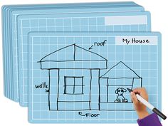 a child's hand drawing a house on a whiteboard