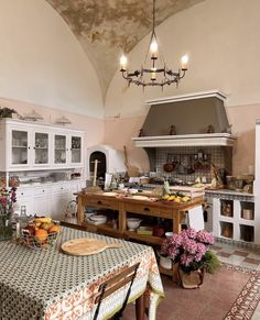 the kitchen is clean and ready to be used for cooking or dining dinner guests are seated at the table in front of the stove