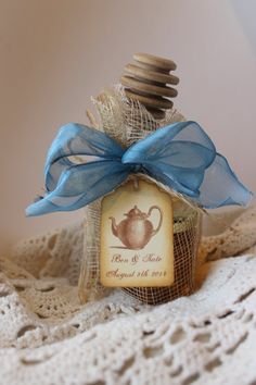 a bottle with a label on it sitting on a doily