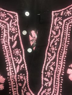 "Pit to pit 22\"Extra room measures 22 Side Straight down measure 20\"/sleeve length about 19\"/Length 24 1/2\" /Smoke free environment/Side slits 6 1/2\"/embroidered tunic top/clean no /Button down front/appears to be hand embroidered/ good vintage condition/Last 3 pictures show the backside proving it is hand embroidered.You can see the spread from one flower to the other. This shirt has a lot of work into it (9)" Black Cotton Top With Chikankari Embroidery, Casual Festive Blouse With Chikankari Embroidery, Casual Blouse With Chikankari Embroidery For Festive Occasions, Casual Long Sleeve Kurta For Festivals, Traditional Floral Print Tunic Top, Casual Pink Tops With Printed Motifs, Casual Embroidered Straight Kurta Top, Traditional Block Print Festive Tops, Pink Cotton Tops With Printed Motifs