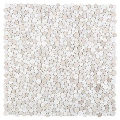 a white and beige rug with pebbles on it's sides, in the shape of circles