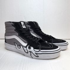 Black, Gray And White High Top Skate Shoes From Vans. Brand New Without Tag. Gray Skate Shoes With Contrast Sole For Streetwear, Gray Skate Shoes With Cushioned Footbed, Urban Gray Round Toe Skate Shoes, Gray Skate Shoes With Cushioned Footbed And Round Toe, Gray Skate Shoes With Vulcanized Sole And Round Toe, Vans Black Sneakers With Translucent Outsole, Gray Synthetic Skate Shoes For Streetwear, Gray Skate Shoes With Vulcanized Sole, Vans Black Sneakers With Cushioned Footbed