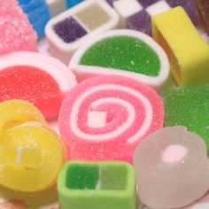 many different colored candies on a plate