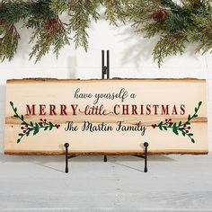 a wooden sign that says merry little christmas