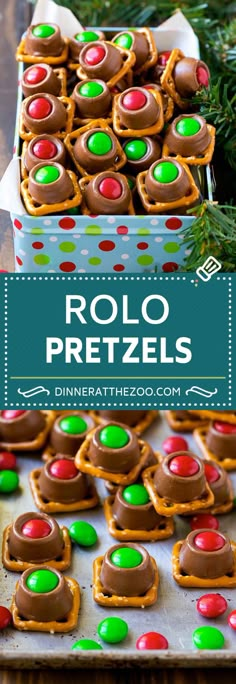 christmas pretzels with chocolate and candy in the middle on a cookie sheet next to a box of pretzels