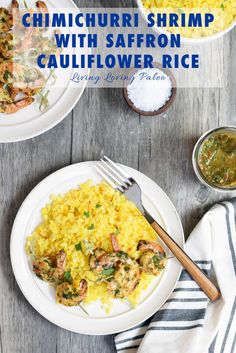 shrimp with saffron and cauliflower rice on a white plate next to a fork