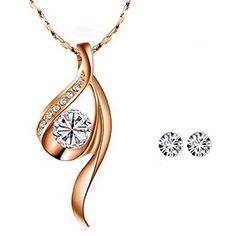 The unique and elegant design of this crystal necklace is eye-catching and beautiful. This necklace is truly a classic piece of jewelry that will go great with all outfits. Pair the necklace with an elegant evening gown as the perfect finishing piece, or wear the necklace to dress up a casual outfit. Necklace Dimensions: Pendant 1.06" x 0.5", 16" chain with 2.25" extendable chain. Necklace Material: Tin Alloy. Earrings Dimensions: 0.19 inch in diameter. Earrings Material: Crystal Elegant Evening Gown, Earring Jewelry Box, Lace Tape, Baby Hair Accessories, Spa Gifts Set, Alloy Earrings, Anklet Bracelet, Jewelry Stand, Anklet Jewelry