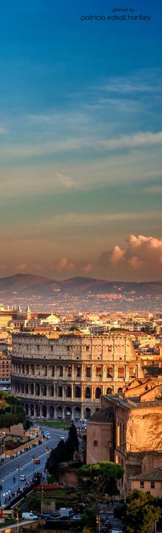 an aerial view of the city of rome, italy at sunset or dawn with clouds in the sky