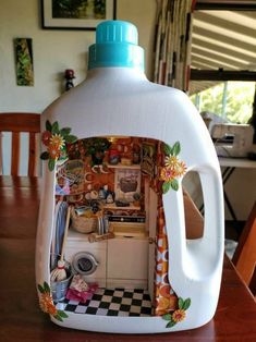 a plastic jug with an image of a kitchen in it on top of a wooden table