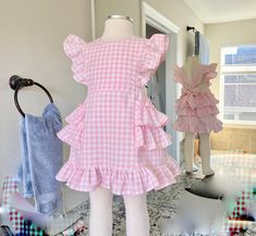 This darling all cotton pink gingham pinafore dress offers loads of ruffles in Carolina Gingham fabric from Robert Kaufman so it's premium cotton and breathable to feel great in the summertime. As is custom with Playful Princess items, the design has our signature flexible fit without fasteners and zippers that may break over time. Adjustable straps loop through the back to tie in a sweet bow. Throw it on over a shirt for a vintage pinafore look during any season. Fitted Gingham Plaid Dress With Ruffles, Gingham Dress With Ruffled Hem And Straps, Gingham Dress With Ruffled Straps And Details, Gingham Dress With Ruffled Straps And Ruffles, Gingham Dresses With Ruffles For Picnic, Gingham Dress With Ruffles For Picnic, Picnic Gingham Dress With Ruffles, Cotton Gingham Plaid Dress With Ruffles, Plaid Ruffled Dress For Picnic