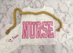 Custom Embroidered NURSE Sweatshirt PINk Nursing School Graduation Pictures, Nursing School Graduation, Nursing Hoodie, Cute Nurse, Er Nurse, Nurse Sweatshirt, High Fashion Outfits, Graduation Pictures, School Graduation