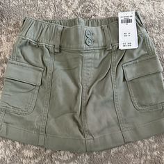 Abercrombie Kids Girls Utility Mini Skirt Sz: 7/8 Color: Green. Nwt High Rise Skort In Lightweight, Knit Twill Fabric, Featuring Utility-Style Cargo Pockets, Built-In Shorts And Double-Buttoned Waist Detail For A Comfortable Fit. Imported. Utility Style, Style Cargo, Abercrombie Kids, Twill Fabric, Lightweight Knit, Kids Bottoms, Kids Shop, Mini Skirt, Comfort Fit