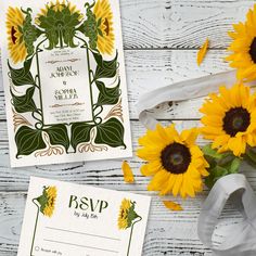 the sunflowers are next to the wedding stationery