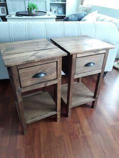 two wooden side tables sitting on top of a hard wood floor next to a couch