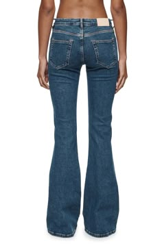 A flared silhouette puts a stylish spin on classic jeans cut from Italian denim with plenty of stretch for day-one comfort. 33 1/2" inseam, 24" leg opening; 9 1/2" front rise; 13 1/2" back rise (size 29) Zip fly with button closure Five-pocket style 82% cotton, 13% modal, 4% polyester, 1% spandex Machine wash, line dry Imported