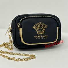 Versace Crossbody Bag Purse Handbag Gold Medusa Logo Chain Strap New Brand New 100% Authentic Made Exclusively For The Versace Fragrance Collection. Gorgeous Crossbody Bag With Lots Of Space! Large Main Compartment With Interior Zippered Pocket And Additional Exterior Pocket! Oversized Gold Medusa Logo On Front. Gold Chain Is Removable!! Measurements: Main Compartment Approx 7” X 4.5” X2” Front Compartment Approx 5.5” X 3.75” X .5” Comes From A Smoke Free Pet Free Home I Ship Fast! Versace Cross Versace Fragrance, Versace Bag, Versace Bags, Gold Handbags, Fragrance Collection, Chain Strap, Gold Chain, Purses And Handbags, Gold Chains