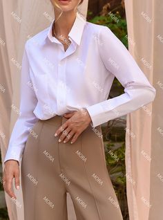 Classic White collared shirt for women. It matches perfectly with pants, skirts and office shorts.  - classic sillohuette  - front buttons - buttoned cuffs - collared -  cotton fabric MATERIAL cotton OTHER ITEMS IN THE PHOTOS: 1. Pink wide leg pants https://www.etsy.com/listing/1234986810/hot-pink-high-waist-trousers-wide-leg 2. Faux leather Bermuda  https://www.etsy.com/listing/965212373/vegan-leather-shorts-for-women-bermuda 3. Pencil Skirt  SIZES The models in photos are wearing a size S Avai White Jumpsuit Formal, Shorts For, Blouse With Long Sleeves, White Collared Shirt, Office Wear Women, Women White Blouse, Women Business, Womens Shirt, Silk Slip Dress