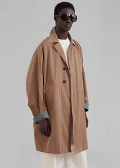 Color: Beige Technical woven fabric Sheen finish Oversized silhouette Pointed collar or notch lapel Drop shoulders Front welted pockets Concealed front button placket closure Grey contrast lining 65% Polyester 35% Cotton Dry Clean By The Frankie Shop. Imported The Frankie Shop, Frankie Shop, Oversized Silhouette, Button Placket, Welt Pocket, Drop Shoulder, Woven Fabric, Trench Coat, Dry Clean