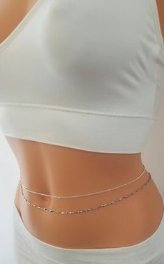 Simple Belly Chain, Belly Chain, Gold Belly Chain Simple and elegant! The newest trend in body jewelry, belly chains are super cute and easy to wear. Perfect on the beach or outfits. Comes elegantly in a gift box or cute organza bag, ready to give. ★Details: ~This listing is for one single layer chain of your choice. ~Available in a variety of designs and finishes. ~The chain is secured at the back with a clasp. ~ 2 inches adjustment chain will be added to the length you want. ~Water resistant ~ Chain Outfit, Body Necklace, Gold Body Chain, Waist Jewelry, Silver Bodies, Belly Jewelry, Layered Chains, Belly Band, Belly Chain