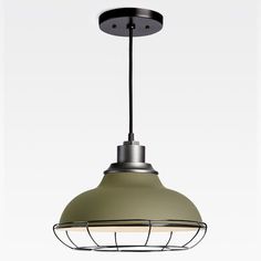 a green light hanging from the ceiling in an industrial style pendant lamp with metal cage around it