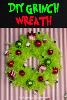 a wreath made out of green tulle and christmas ornaments with the words diy grinch wreath on it