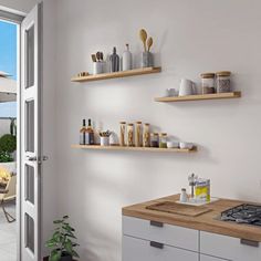 a kitchen with an open door leading to a patio area and outdoor dining table set