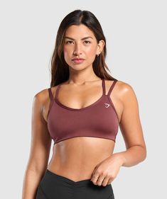 FIND THE ONE Finding the one can be hard. But our sports bras are more trustworthy, supportive & reliable than your ex. • Cute double strap feature• Removable padding lets you to wear it how you want• Light V-neck• Stay-put elasticated underband SIZE & FIT• Body fit • Medium support • Model is 5'8" and wears size XS MATERIALS & CARE• 78% Recycled Polyester, 22% Elastane SKU: B8A6A-RBQV Workout Sports Bra With Adjustable Tank Straps, Sporty Sports Bra With Tank Straps, Sporty Workout Bra With Straps, Sporty Bra For Workout, Sporty Workout Bra, Light Support Sports Bra With Tank Straps For Training, Athleisure Training Bra With Adjustable Straps, Sports Racerback Bra With Straps, Functional Sports Bra With Straps For Training