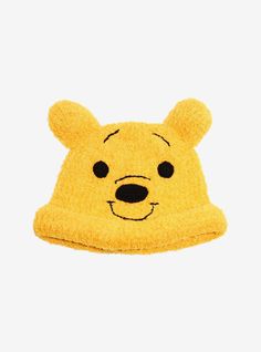 a winnie the pooh hat with black eyes