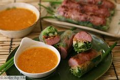 some food is sitting on a green plate and next to another bowl with soup in it