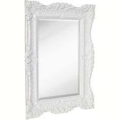 a white framed mirror with an ornate design on the front and bottom edge, against a white background