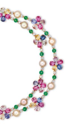 A MULTI-GEM NECKLACE, BY BULGARI. The front designed as two swags of flowerheads set to the centre with a circular-cut diamond, within a pear-shaped multi-coloured sapphire surround, joined by button-shaped cultured pearls, measuring 9.60 mm, alternating with emerald roundels and circular-cut diamonds, extending to the backchain, mounted in gold, 40.4 cm. Signed Bulgari, Italy. Gems Necklace, Necklaces Ideas, Bulgari Jewelry, Jewel Necklace, Gem Necklace, Gold Jewelry Fashion