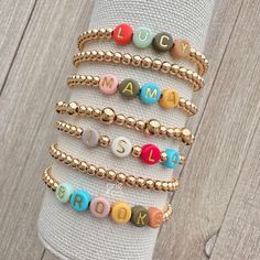 Name Bracelet, 14k Gold Beaded Bracelet, Personalized Jewelry, Mama Gift, Mama Bracelet, Custom Bead Bracelet, Custom Gift, Gift for Mom by ArieAndCo on Etsy Gold Letter Beads Friendship Bracelets For Jewelry Making, Gold Friendship Bracelets With Letter Beads For Jewelry Making, Gold Stretch Bracelet With Colorful Beads For Birthday, Personalized Gold Jewelry With Colorful Beads, Gold Name Bracelet With Colorful Beads For Birthday, Gold Name Bracelet With Colorful Beads For Friendship, Personalized Gift Stackable Bracelets With Round Beads, Gold Friendship Bracelets With Colorful Beads For Birthday, Personalized Gift Bracelets With Colorful Round Beads