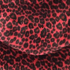 a red and black animal print coat