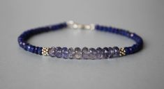 Iolite Bracelet With Lapis Lazuli Lapis Lazuli Bracelet - Etsy Adjustable Faceted Sapphire Bracelets, Adjustable Faceted Sapphire Bracelet, Blue Faceted Beaded Bracelets As Gift, Blue Faceted Beaded Bracelets For Gift, Faceted Blue Beaded Bracelets As Gift, Blue Rondelle Bracelets With Natural Stones, Bohemian Blue Faceted Bracelet, Adjustable Sapphire Beaded Bracelets With Gemstones, Blue Everyday Bracelet Jewelry