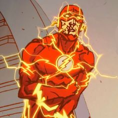 the flash standing in front of a tall building