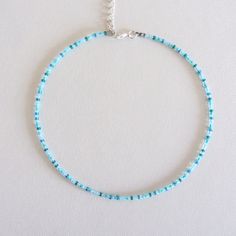 Turquoise Bead Choker White Beaded Choker Seed Bead Choker Colorful Bead Choker Boho Choker Trendy Choker Beach Choker Seed Bead Necklace Measure the length of your neck with a measuring tape or you can use any thread, rope, or cable for telephone and after apply the measurements to a regular ruler. These are multi-colored, opaque shiny beads of size 10/0. Choker is 13 inches with a 2 inches adjustable extender chain. 15 inches full length. Summer Blue Necklaces With Spacer Beads, Turquoise Heishi Beads Jewelry For Vacation, Blue Beaded Necklaces With Spacer Beads For Summer, Blue Beaded Necklace With Spacer Beads For Summer, Blue Beaded Necklaces For Jewelry Making In Summer, Light Blue Beaded Necklaces With Round Beads For Summer, Blue Tiny Beads Necklaces For Beach, Blue Heart Beads Bracelets For Beach, Vacation Heishi Beaded Necklaces