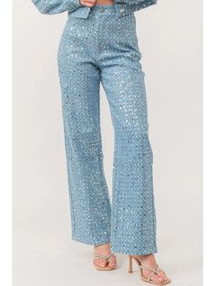 Merge modern aesthetics with a touch of luxury in our Sequined Distress Denim Delight. These denim pants are meticulously adorned with shimmering sequins, adding a radiant contrast to the raw appeal of distressed denim. The 5-pocket design ensures functionality while the front zip and button closure offer a seamless fit. Crafted in 100% pure cotton, these pants promise both style and comfort. To retain their dazzling allure, remember to give them a gentle hand wash. Perfect for the contemporary Straight Leg Jeans For Spring Night Out, Denim Blue Straight Leg Jeans With Rhinestones, Denim Blue Rhinestone Straight Leg Jeans, Denim Flare Jeans For Night Out In Spring, Wide Leg Denim Jeans For Night Out, Chic Embellished Pants For Fall, Glamorous Straight Leg Sequin Pants, Glamorous Sequin Straight Leg Pants, Trendy Straight Leg Party Jeans