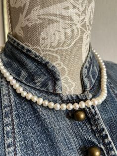 A lovely cultured pearl necklace with subtle glow. It features linked up sphere shaped white coloured cultured pearls, a metal clasp with extra chain with a single pearl attached at the end. The original tag is attached and it reads Cultured Pearl Freshwater. It measures approximately 49.5cm overall length including the closing clasp and the end chain.  It is a lovely timeless style of necklace that suits with your occasional dress.  It is in very good condition with no significant flaws. Sold a Baroque Pearl Necklace With Pearl Charm, Vintage Round Necklace With Pearl Charm, Formal Baroque Pearl Necklace With Round Beads, Vintage Akoya Pearl Drop Necklace, Akoya Pearl Drop Necklaces With Round Beads, Akoya Pearl Drop Necklace With Round Beads, Akoya Pearl Drop Necklace, Formal Pearl Drop Necklace With Round Beads, Classic Pear-shaped Pearl Necklace With Charm