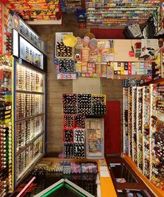 a store filled with lots of different types of items and colors on the walls,