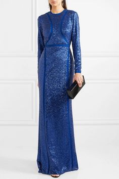 Inspired by oceanic hues and shimmering water, Elie Saab's gown is saturated with 'Pacific Blue' sequins that beautifully catch the light. This silk-blend piece is cut for a close, figure-hugging fit and spliced with tulle panels that are cleverly placed to slim your frame. Wear it to galas, awards ceremonies and formal events with an updo and simple black or metallic accessories. Princess Marie wore the gown in a sleeveless version. This floor length gown clings close to the body. It is crafted Festive Evening Gown With Contrast Sequin, Blue Sequined Evening Dress For Gala, Blue Sequin Dress For Wedding, Glamorous Blue Evening Dress, Glamorous Blue Evening Gown, Glamorous Blue Gown For Evening, Blue Sequined Gown For Gala, Blue Sequined Evening Dress For Wedding, Festive Evening Gown With Sequins