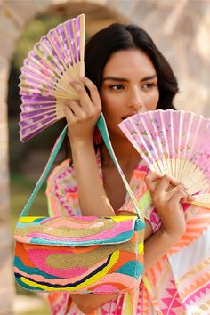 Handwoven Jacquard Beaded bag Vibrant hues of yellow, pink, green, and gold. Stunning hand-embellished embroidery and beadwork Embellished shoulder straps Magnetic Button closure Lined interiors with zip pocket Size: 10" X 5.5" X 2" Handmade by Artisans Introducing the Wave Multi Shoulder Bag" – a mesmerizing blend of artistry and functionality that captures the essence of summer in every stitch. Handwoven with exquisite Jacquard fabric, this bag boasts vibrant hues of yellow, pink, green, and Evening Multicolor Shoulder Bag With Adjustable Strap, Multicolor Summer Clutch Evening Bag, Multicolor Clutch Evening Bag For Summer, Multicolor Beaded Handheld Shoulder Bag, Embellished Multicolor Summer Shoulder Bag, Multicolor Evening Shoulder Bag With Removable Pouch, Multicolor Beaded Shoulder Bag, Embellished Multicolor Shoulder Bag For Summer, Multicolor Embellished Rectangular Shoulder Bag