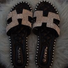 Anna. Brand New In Box. Shiny Silver Bling Sandals/ Slip Ons. Black Quilted Footpad With Mini Studs Around Edge. Rhinestones On Straps. Size 8 1/2” Us Silver Sandals With Bling And Round Toe, Silver Bling Sandals With Round Toe, Black Bling Sandals For Night Out, Silver Flat Sandals With Bling, Silver Synthetic Sandals With Bling, Black Bling Sandals For Summer, Casual Black Sandals With Rhinestones, Trendy Black Sandals With Rhinestones, Summer Black Sandals With Bling