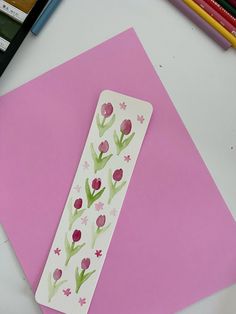 a piece of paper with flowers painted on it